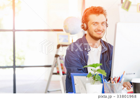 Young man working in office 33801968