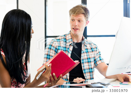 Young office workers discussing 33801970