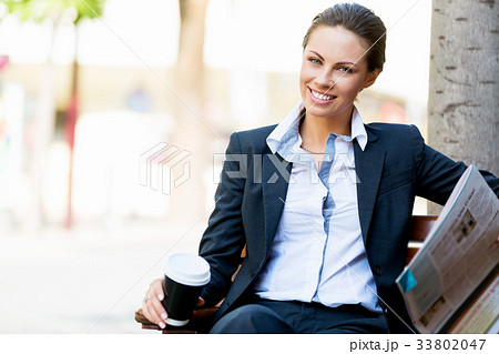Portrait of business woman smiling outdoor 33802047