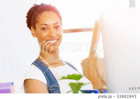 Portrait of smiling afro-american office worker in offfice Portrait of smiling afro-american office worker in offfice 33802845