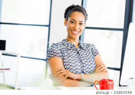 Portrait of smiling afro-american office worker in offfice Portrait of smiling afro-american office worker in offfice 33803549