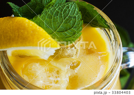 Fruit cocktail partially seen on black background Fruit cocktail partially seen on black background 33804403