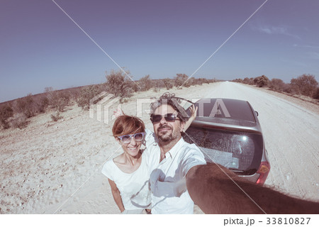 Adult couple selfie on road trip in the desert Adult couple selfie on road trip in the desert 33810827