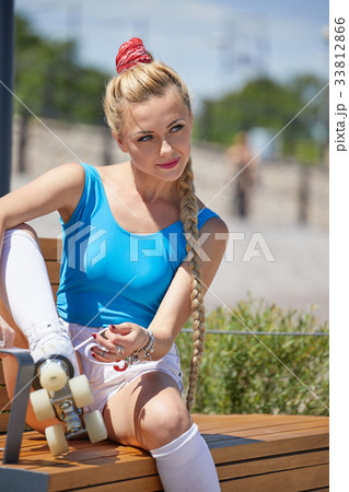 beautiful young blonde girl in a vintage roller skates,  33812866