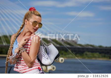blonde girl in a vintage roller skates, wearing shorts, blonde girl in a vintage roller skates, wearing shorts, 33812926