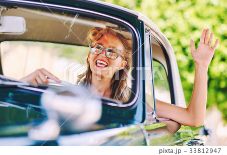 Woman sitting in a car Woman sitting in a car 33812947