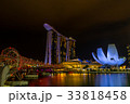 Helix Bridge and Marina Bay Sand in evening 33818458
