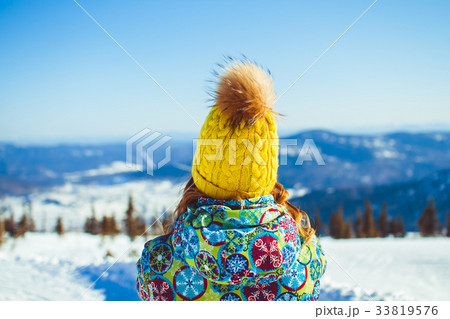 woman in hat in the mountains in winter woman in hat in the mountains in winter 33819576
