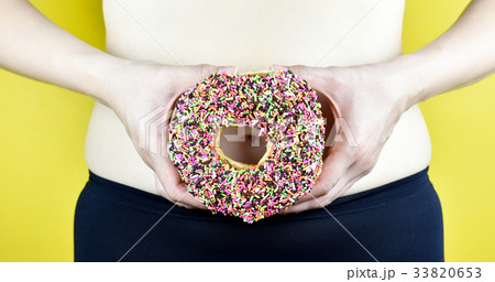 Overweight fat woman from sweet donut. Overweight fat woman from sweet donut. 33820653