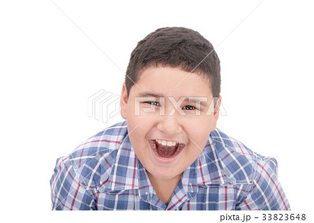 A boy screaming loud with mouth wide open 33823648
