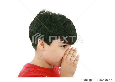 a boy is telling a secret with a hand symbol 33823677