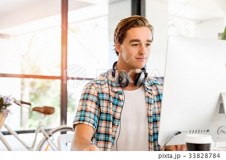 Young man working in office 33828784