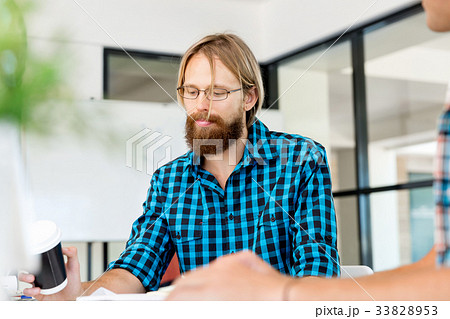 Young man working in office Young man working in office 33828953