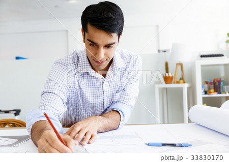 Young man architect in office Young man architect in office 33830170