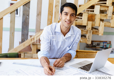 Young man architect in office Young man architect in office 33830276