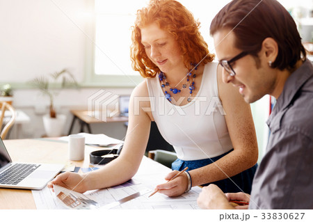 Two young architects in office Two young architects in office 33830627