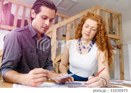 Two young architects in office Two young architects in office 33830975
