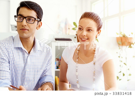 Two young people in office Two young people in office 33831418