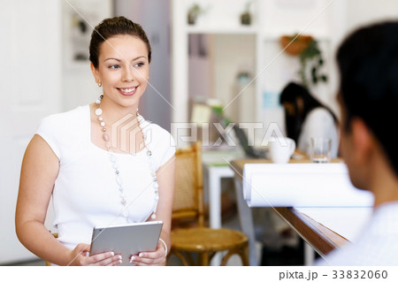Successful young business executives meeting at the office Successful young business executives meeting at the office 33832060