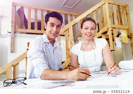 Two young architects in office Two young architects in office 33832114