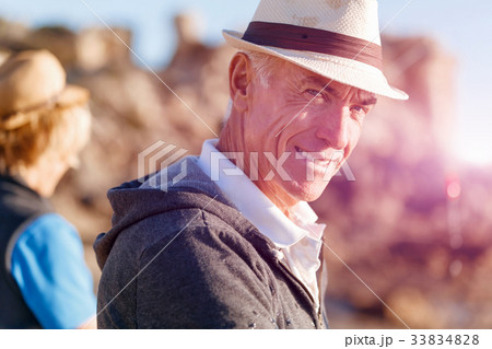 Senior man fishing with his grandson 33834828