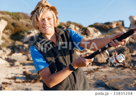 Teenage boy fishing at sea 33835208