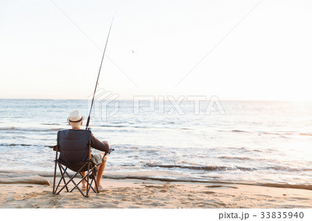 Senior man fishing at sea side Senior man fishing at sea side 33835940