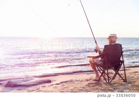 Senior man fishing at sea side Senior man fishing at sea side 33836050
