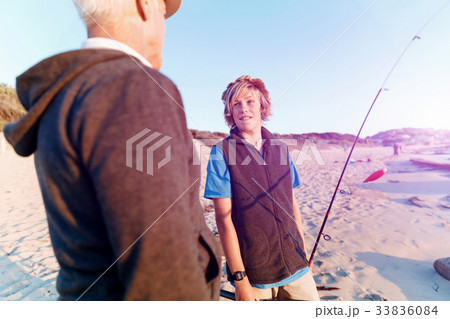 Teenage boy fishing at sea Teenage boy fishing at sea 33836084