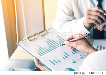 Business man pressing summary report chart  33841831