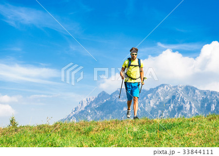 Young man practicing physical activity mountain and running with Young man practicing physical activity mountain and running with 33844111