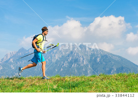 Young man practicing physical activity mountain and running with Young man practicing physical activity mountain and running with 33844112