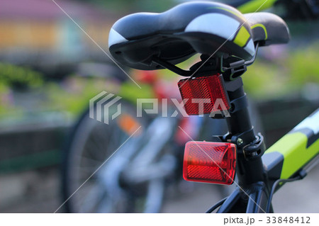 Back lights bicycle on street background Back lights bicycle on street background 33848412