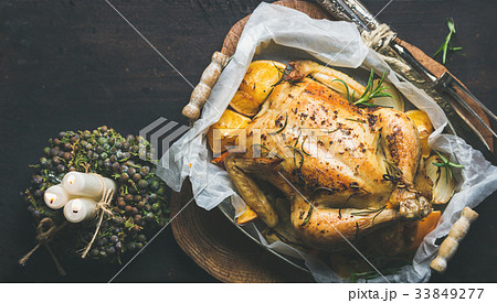 Close-up of roasted chicken with oganges, bulgur Close-up of roasted chicken with oganges, bulgur 33849277