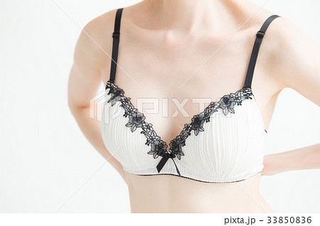 下着姿の女性 白バックの写真素材