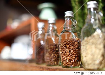 Coffee beans inside the clear bottle. Coffee beans inside the clear bottle. 33853094