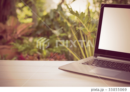 Computer laptop with blank white screen wooden Computer laptop with blank white screen wooden 33855069