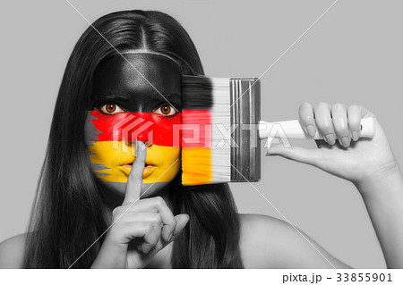 Female supporter in national colors of Germany Female supporter in national colors of Germany 33855901