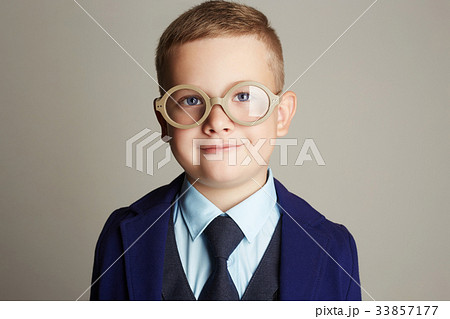 smiling little boy in suit and tie 33857177