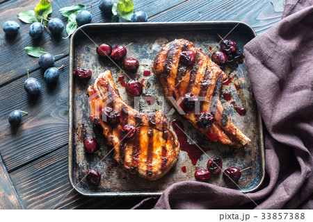 Grilled pork ribs with plum sauce Grilled pork ribs with plum sauce 33857388