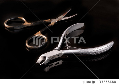 nail scissors and clippers to remove the cuticle 33858680