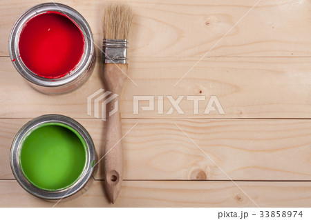 green and red paint in the bank with brush on the 33858974