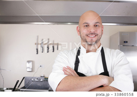 Portrait of a professional chef smiling 33860558