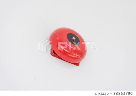 red fire alarm on white wall 33863790