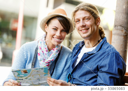 Girl and guy on the streets of a city 33865083