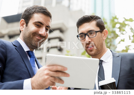 Two businessmen talking outdoors 33865115