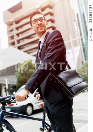 Young businessmen with a bike Young businessmen with a bike 33865337