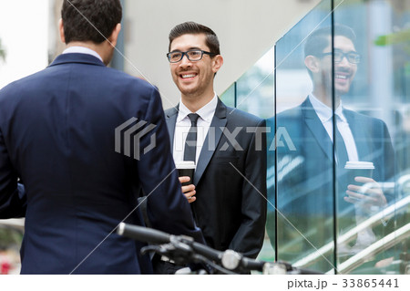 Two businessmen talking outdoors 33865441