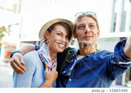 Smiling couple with the camera 33865490