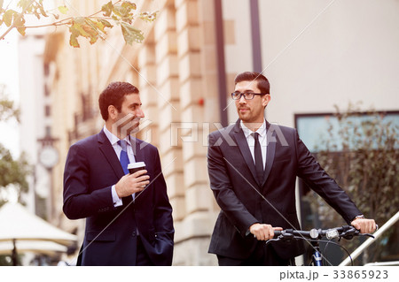 Young businessmen with a bike 33865923